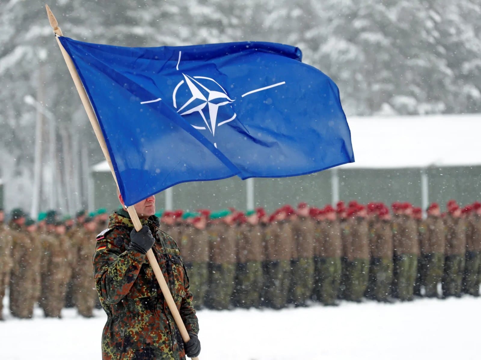 NATO flag at a military formation as US warns Poland of a possible Russian provocation amid the Ukraine war.