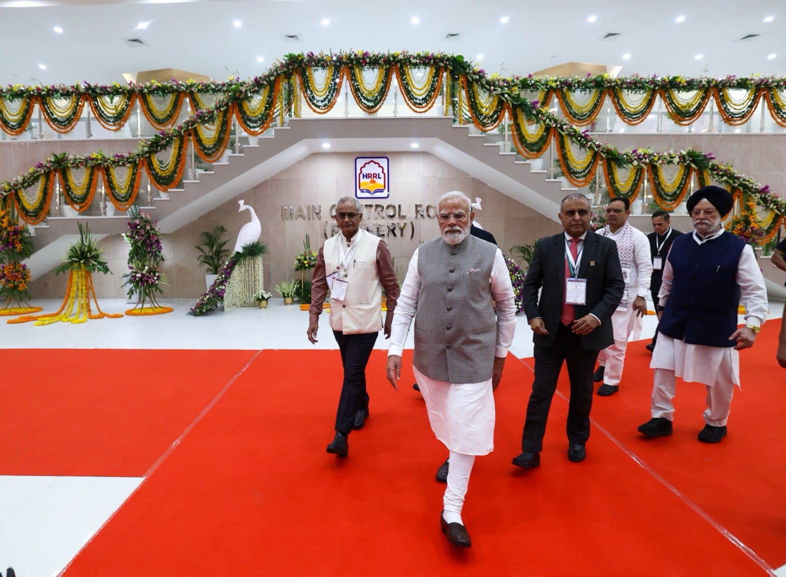Prime Minister Narendra Modi walks through the newly inaugurated HRRL Pachpadra refinery complex in Rajasthan during the opening ceremony.