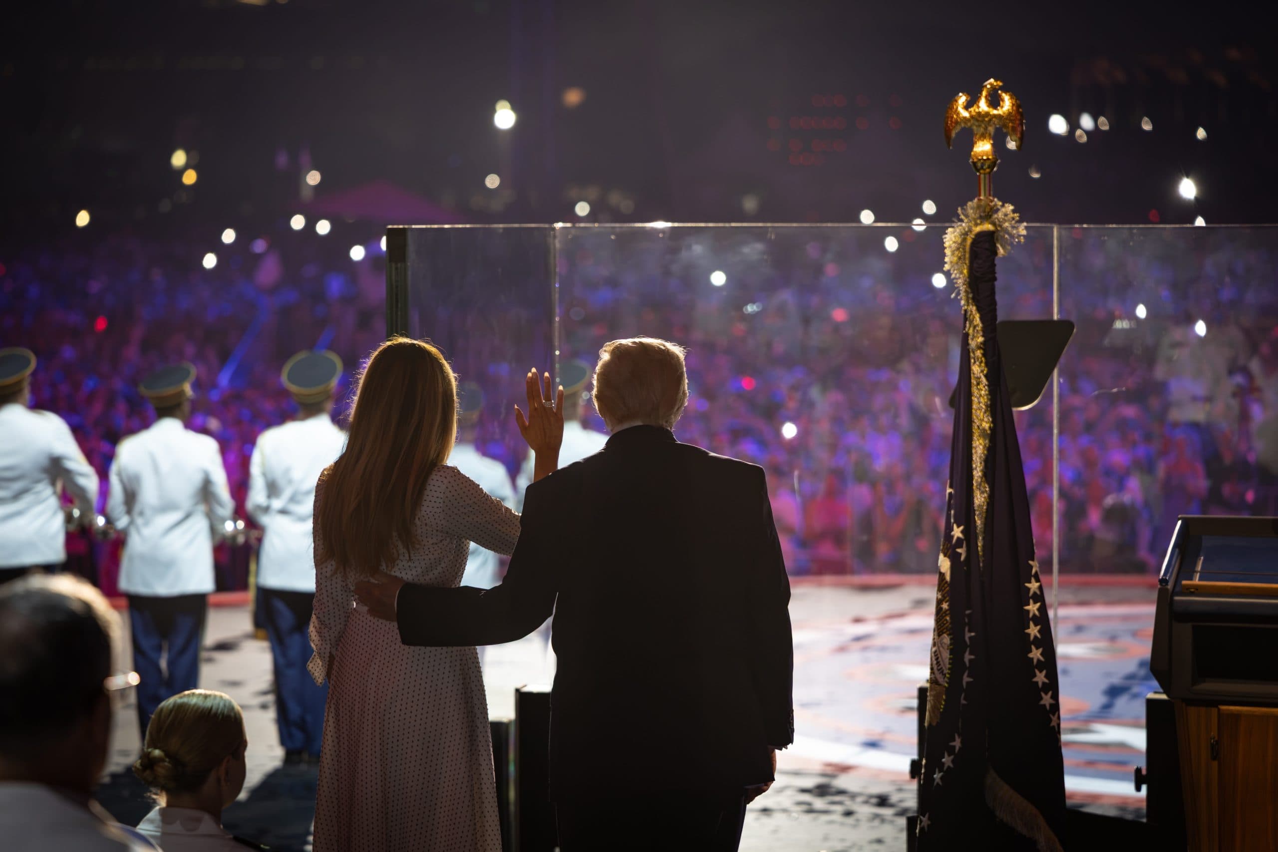 Donald Trump waves to the crowd during the US 250th anniversary rally at the National Mall after severe storms delayed the celebrations.